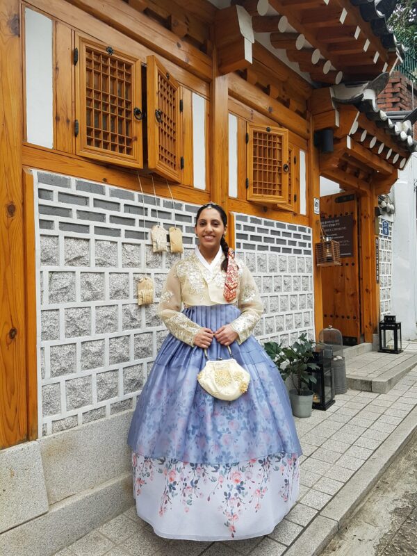 A woman dressed in a Hanbok at Bukchon Hanok Village in Seoul