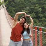 Couple taking a photo on DMZ Gamaksan Red Suspension Bridge