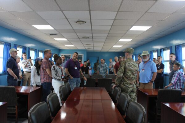 A photo of one of our tour groups inside the the blue UNCMAC Conference Room at Joint Security Area in Panmunjom